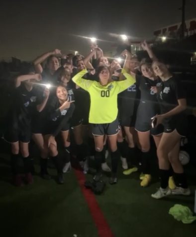 The Montclair Girls JV Soccer Team celebrate their win in the dark.