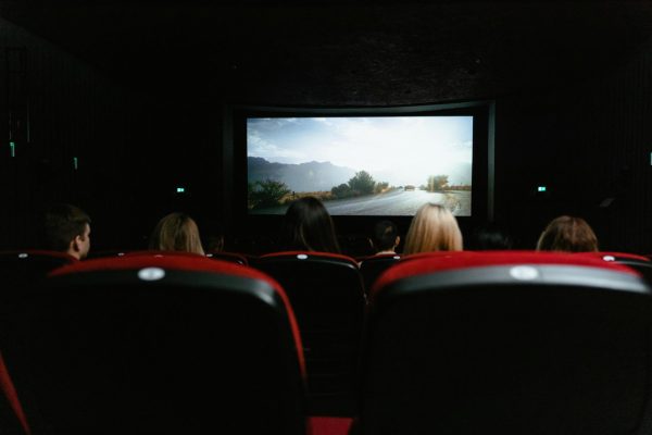 A group of people watching a movie in the theathers